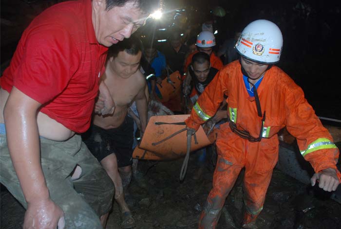 It was China's worst train accident since April 2008, when a train traveling from Beijing to the eastern coastal city of Qingdao derailed and crashed into another train, leaving 72 people dead and another 416 injured.<br><br>In this picture, Chinese firefighters rescue survivors after a Chinese high-speed train derailed and two of its carriages fell off a bridge after a lightning strike knocked out power on the line on July 23, 2011, as the train was travelling between the cities of Hangzhou and Wenzhou, in eastern China's Zhejiang province. The train went off the rails around 8:30pm (1230 GMT), Xinhua news agency reported, citing local firefighting sources, that at least 35 people were killed and 191 people were injured. (AFP Photo)