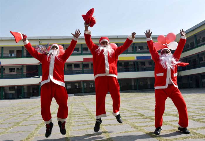 Children dressed up as Santa Claus during Christmas celebrations at a missionary school in Bhopal. (PTI Photos)