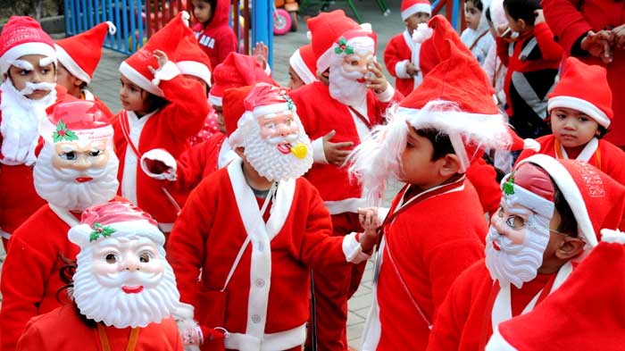 Kids dressed up as Santa Claus during Christmas celebrations in a school in Amritsar. (PTI Photos)