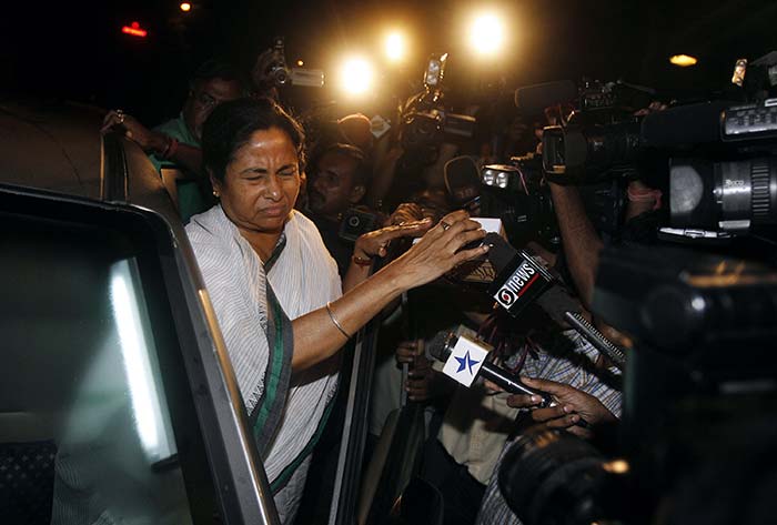 Mamata Banerjee navigates through the crowded streets of Kolkata in a beaten-up Maruti Zen.