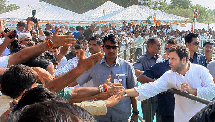 Rahul Gandhi shakes hands with supporters at a Congress rally in Churu, Rajasthan on October 23, 2013.