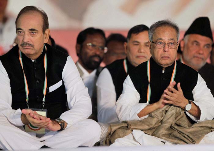 Grim tales? Ministers Ghulam Nabi Azad and Pranab Mukherjee seem to find little to cheer about at at the plenary session