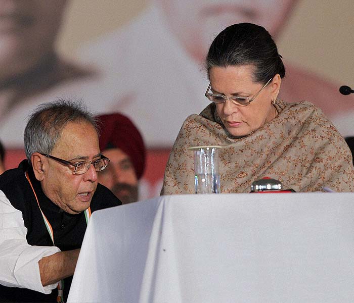 And at your service, Madame President. Finance Minister Pranab Mukherjee is kept busy at the 83rd Congress plenary session.