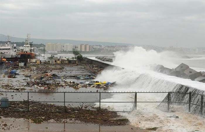 Strong winds and heavy rains pounded the eastern coastline on Saturday, as authorities rushed to move tens of thousands of people away from the cyclone. Seen here: Waves crash onto the shore at a fishing harbour in Visakhapatnam district in Andhra Pradesh.