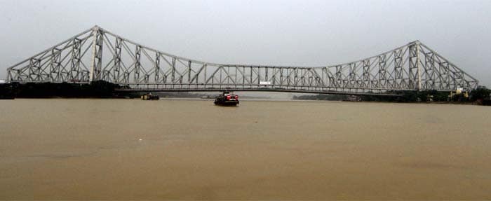 Water level of river Ganga rises under Howrah Bridge as Cyclone Phailin approaches the coastal area of Odisha.