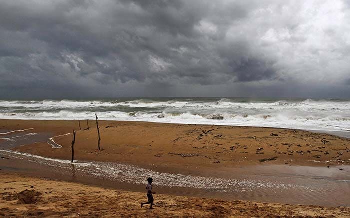 A boy enjoys the surf minutes before he was packed off from Odisha's Gopalpur coast.