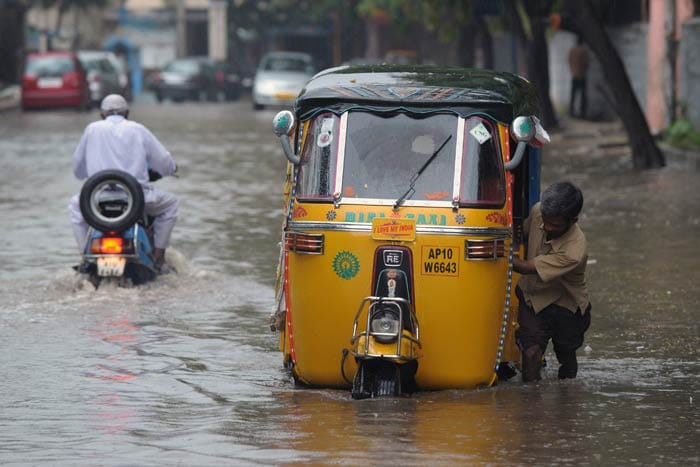 Heavy rainfall lashed parts of coastal Andhra Pradesh on Friday. Cyclone Phailin is expected to hit the state tomorrow. Currently winds are touching a high speed of 220 km per hour.
<br><br>
Photo credit: AFP