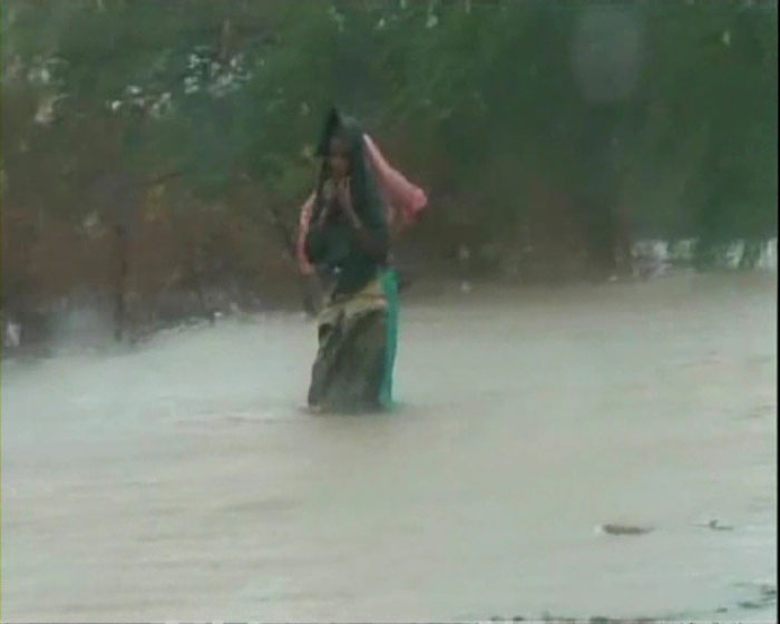 The strong winds with speed crossing 100 km per hour uprooted trees and damaged mango, banana and other horticulture crops over thousands of acres.Authorities said the exact damages would be known after the rains recede.