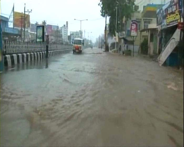 Road transport has come to a standstill due to rains and uprooted trees. The Chennai-Kolkata national highway in Ongole town is under four feet water.