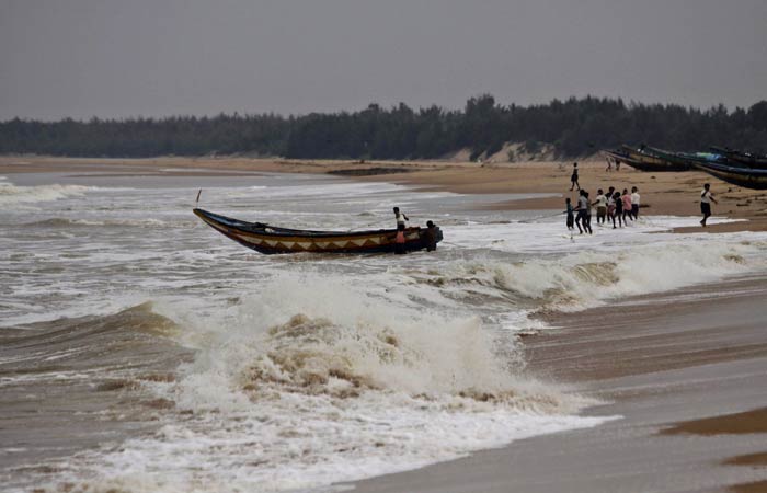 Seen here, fishermen pull out a country boat from the Bay of Bengal at Gokhurkuda in Ganjam district 215 kilometers (136 miles) away from the eastern Indian city of Bhubaneswar. Paradip Port in Odisha, one of the 12 major ports in the country, has shut all cargo operations, plants and machinery and put in place a contingency plan to meet any eventuality due to Cyclone Phailin.