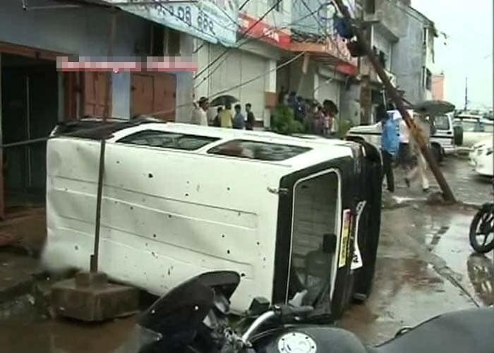 While Odisha has reportedly evacuated over 7.2 lakh people, Andhra Pradesh has moved about a lakh to safety. A massive relief operation has been mounted by multiple state and central agencies. Seen here, an upturned car in Behrampur, Odisha.