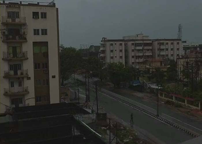 In capital Bhubaneswar, there was no power all of last night as the power supply was cut as a precautionary measure as strong winds have uprooted trees and electricity poles, one official said. Seen here, a lone man is seen walking on a street in Bhubaneswar.