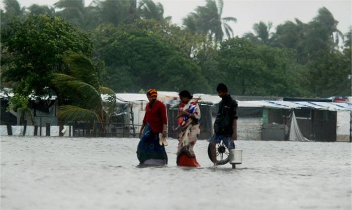 People at Marina Beach after Cyclone Thane in Chennai on Friday.