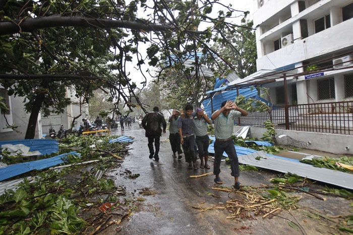 The storm crossed the coast between Cuddalore and Puducherry bringing in its wake torrential rains accompanied by gale that uprooted hundreds of trees and knocked electric poles, snapping power supply in several areas.