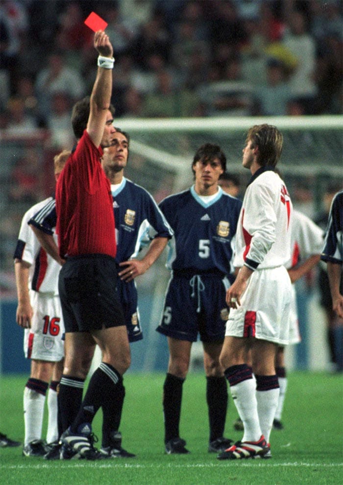 Beckham, who began his career at Manchester United in 1992, made his England debut against Moldova in September 1996. The low point of his international career came at his first World Cup, in 1998, when he was sent off for petulantly kicking out at Argentina midfielder Diego Simeone. <br><br>England lost the round of 16 match and some England fans hung effigies of Beckham. Beckham managed to bounce back and captained the team at the 2002 World Cup under coach Sven-Goran Eriksson. (AP Photo)