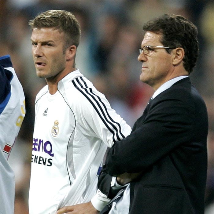 Despite initially falling out of favor under Capello before being restored to the team when both were at Real Madrid, Beckham's international career survived when the Italian took over as coach from McClaren. (AP Photo)