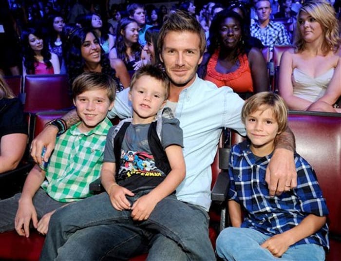 On a happier note for Beckham, recently he had a boys' day out with his sons at the Teen Choice awards in California. <br><br>Beckham took his three sons, Brooklyn(11), Romeo(7) and Cruz(5) to the glitzy awards ceremony where he picked up the Male Athlete gong, which was in the shape of a surfboard. His boys joined him on stage and threw footballs signed by their dad into the crowd. (AP Photo)