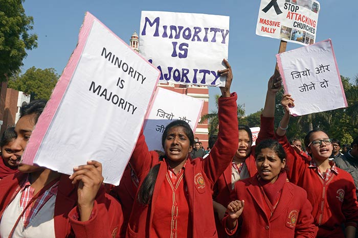 Indian Christians hold placards as they shout slogans during a protest outside the Sacred Heart Cathedral following recent attacks on churches in New Delhi on February 5, 2015.