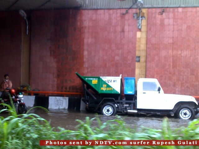 Many people were seen taking shelter below flyovers and bus stops across the city. Many scooterists parked their two-wheelers below the flyover resulting in shrinking of road space for vehicular movement. (Pic: Rupesh Gulati) <br><br><b>Be an I-Witness</b><br><br>You too can share your story through photos and videos. Just upload them here and we'll feature the best entries on Ndtv.com.<br><br><iframe  src="http://www.ndtv.com/convergence/ndtv/new/iframe_NDTVShowUpload.aspx?Template=iwitness&ReqEmail=1&ShowCity=1&ReqCity=1&type=a&ShowDisclaimer=0"  width="400" height="200"  scrolling="no" frameborder="0"> </iframe>