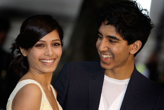 <em>Slumdog Millionaire</em> actors Dev Patel and Freida Pinto were spotted at the London Fashion Week. They attended the end of London fashion week Burberry show in central London. (Photo: AP)