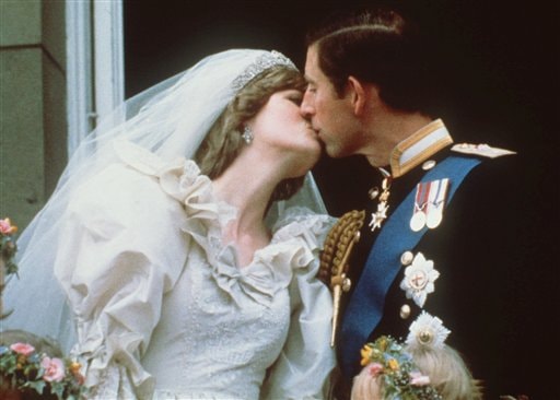 Kiss the Bride: Britain's Prince Charles kisses his bride, the former Diana Spencer on the balcony of Buckingham Palace in London after their wedding.