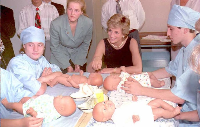 Global appeal: Diana contributed a lot to charitable works. Several credits were also given to her for her efforts as well. <br><br>
In the picture, The Princess of Wales chats with students practicing with dolls at the college of the Tushino children's hospital in Moscow.