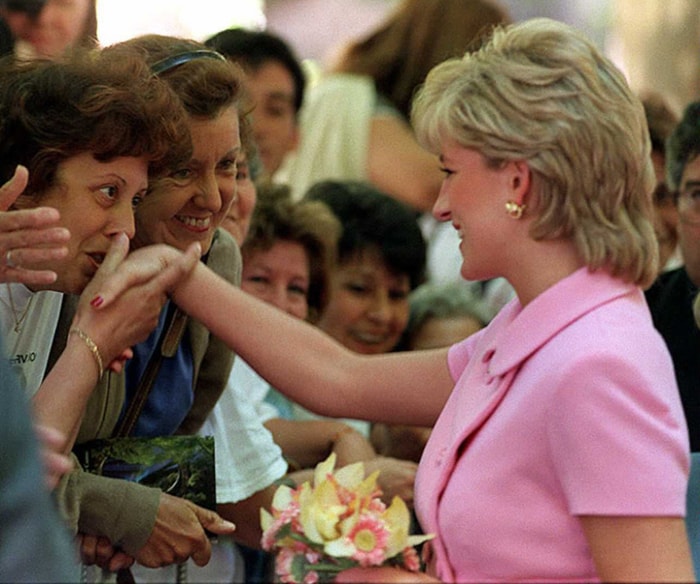 One for the masses: Diana, Princess of Wales, is greeted by supporters during her visit to the Doctor Angel Roffo hospital in Buenos Aires. Diana was a crowd favourite almost everywhere she stepped.