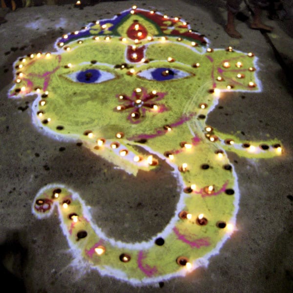 The remover of all obstacles - A Lord Ganesha 'Rangoli' on the eve of Diwali in Varanasi. (PTI Photo)