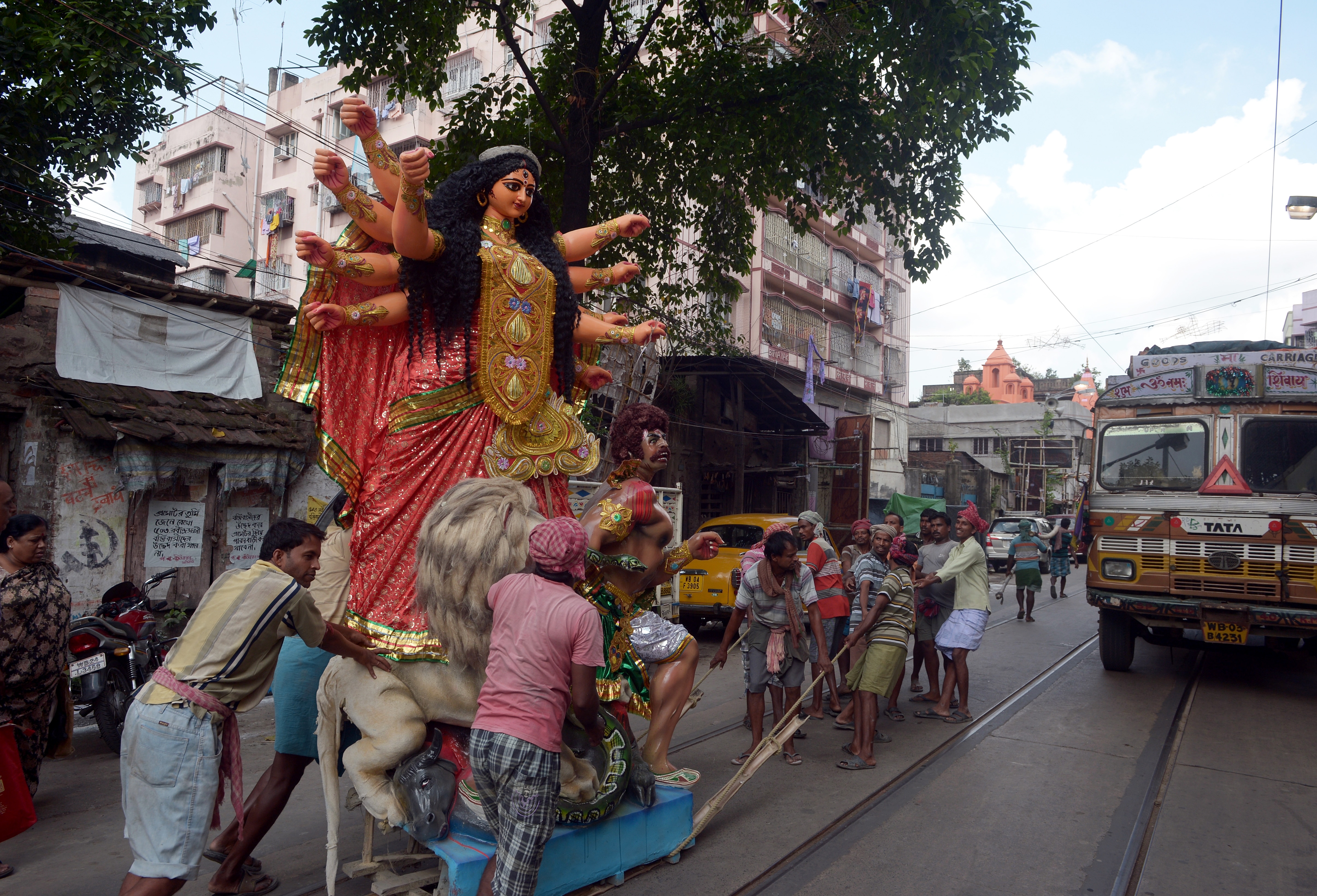 Labourers move an idol of Goddess Durga in Kolkata. (AFP)