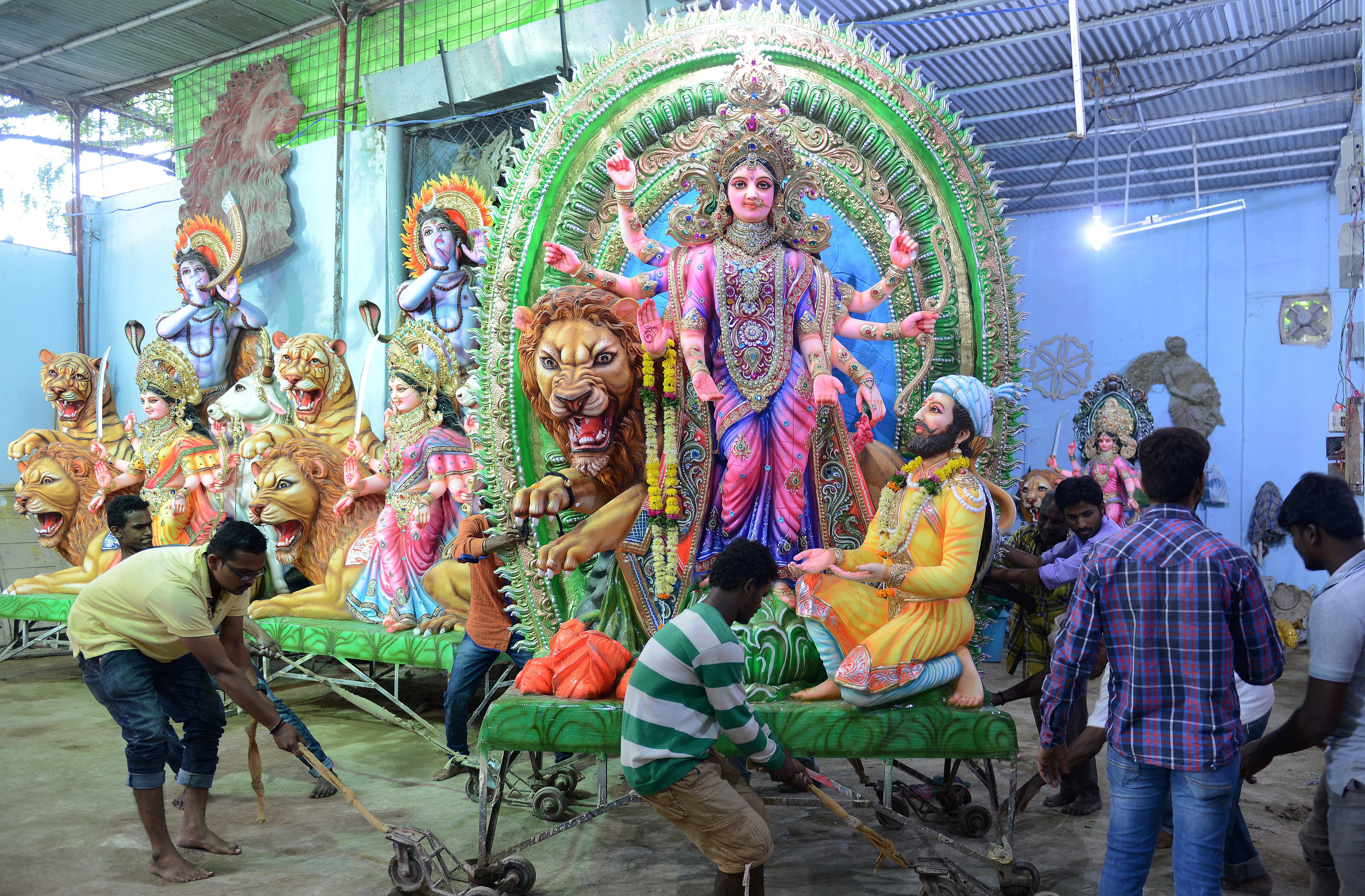 Visitors gather inside a puja pandal in Siliguri. (AFP)