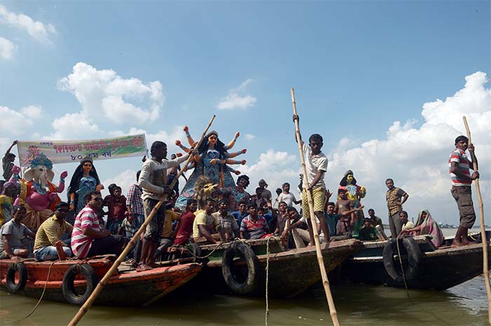 An idol of Goddess Durga being transported to a puja pandal in Kolkata. (AFP)