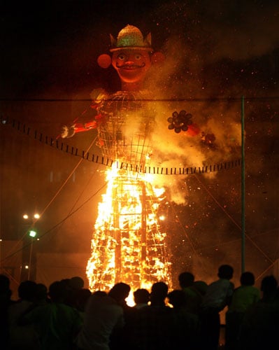 <b>Evil dies:</b> The effigy of the evil king Ravana burns during 'Dussehra celebrations' at Ramlila Maidan in New Delhi. (PTI)