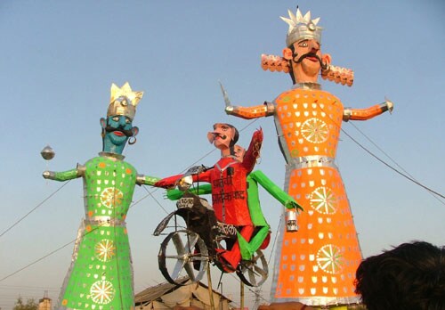 <b>Evil of terror:</b> An effigy of a terrorist, on a bike, hangs with effigies of demon king Ravana, on the eve of Dussehra celebrations in New Delhi. (PTI)