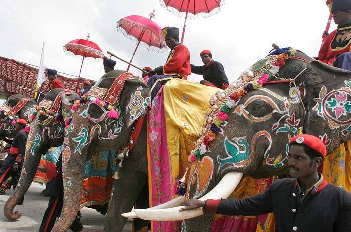 Mahouts ride decorated elephants as they pass by the Mysore Palace on the last day of the Dusshera celebrations.