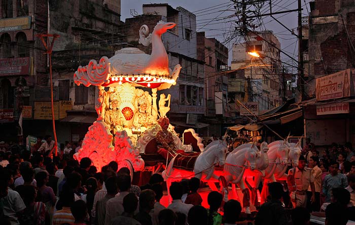 Crowds gather to watch a procession led by artistes portraying Lord Rama (left) and his brother Lakshman in Allahabad.