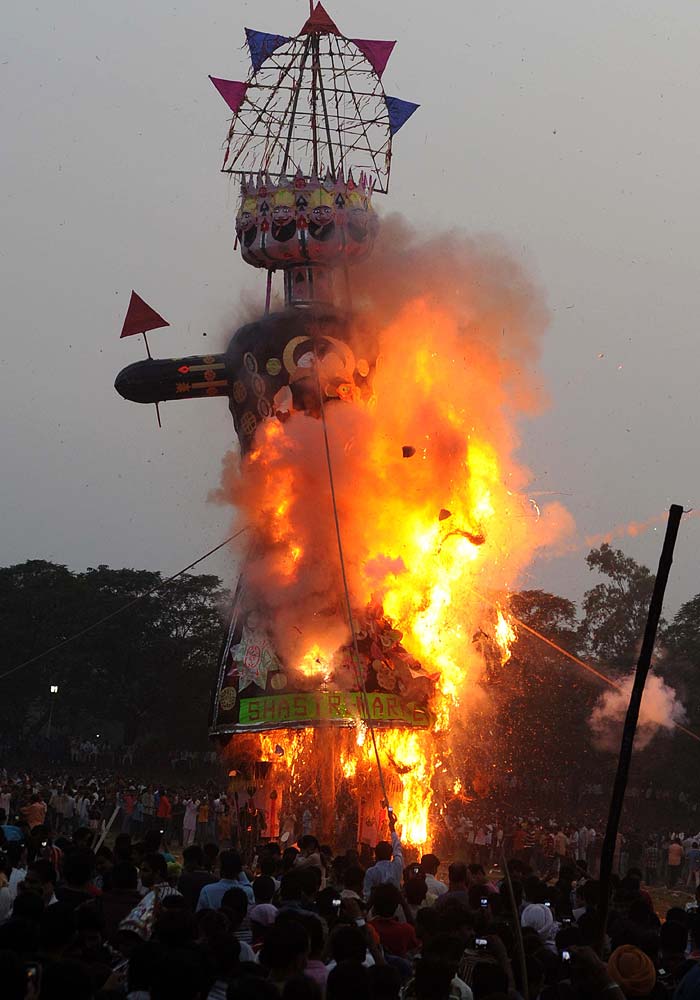 An effigy of Ravana, stuffed with fire-crackers, burns on the grounds of Durgiana temple in Amritsar.