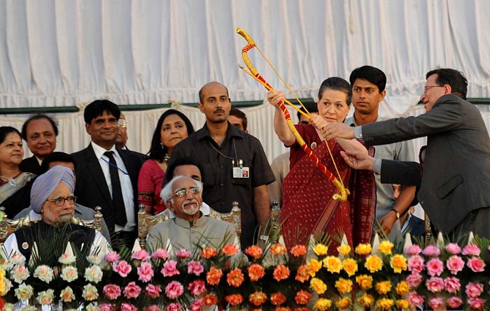 Congress president Sonia Gandhi gets into the festive spirit by posing with a bow and arrow. The act symbolizes the killing of Ravana by Lord Rama, and is celebrated by Indians through the festival of Dusshera every year.