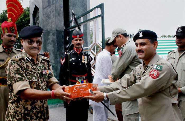 Officials of the Border Security Force and Pakistan Rangers exchange greetings on the occasion of Eid.