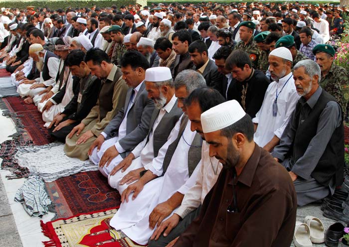 Afghans offer prayers for the Eid al-Fitr holiday that marks the end of the Muslim holy month of Ramadan in Kabul, Afghanistan.