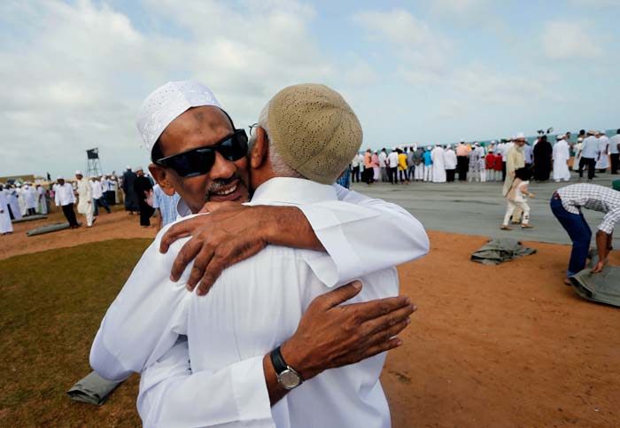 Sri Lankan Muslims embrace each other as they celebrate Eid al-Fitr in Colombo, Sri Lanka.