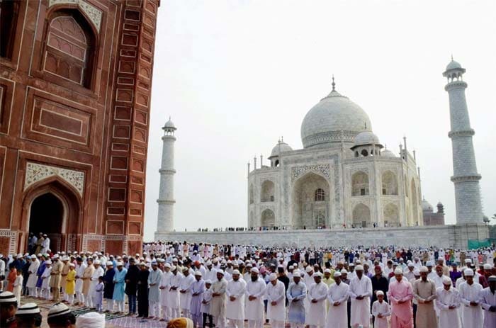 Devotees offer prayers on the occasion of Eid al-Adha at Taj Mahal, Agra on Tuesday. (PTI Photo)