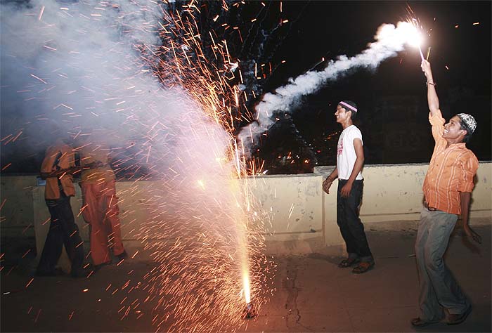 <strong>Celebrations begin:</strong> Muslims burn fire crackers after seeing the moon in Allahabad.<br />
<br />
Eid-ul-Fitr, a Muslim feast marking the end of the fasting month of Ramadan will be celebrated across the country on Monday. <em>(AP)</em>