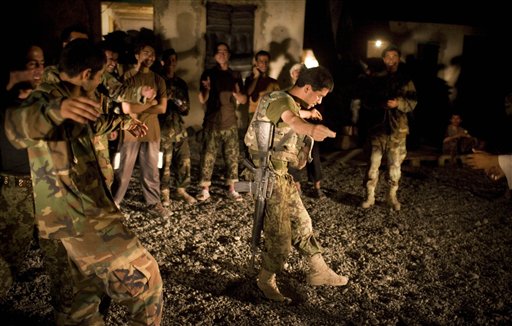 It was time for celebrations also at combat outpost outside Salavat in south-west of Kandahar in Afghanistan as Afghan army soldiers danced to celebrate Eid. (AP Photo)