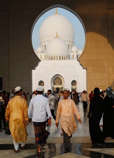 Muslims in Abu Dhabi leave the Sheikh Zayed Ground Mosque after performing their prayers.(AP Photo)