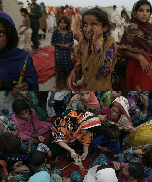 In the flood ravaged city of Pakistan, A woman volunteer paints the hands of the flood affected children as they prepare to celebrate Eid at a camp setup for displaced people in Muzaffargarh district. <br><br> Whereas, in an ironical situation, another girl at the same camp site cries as she fails to get gifts from the volunteers. (AP Photo)