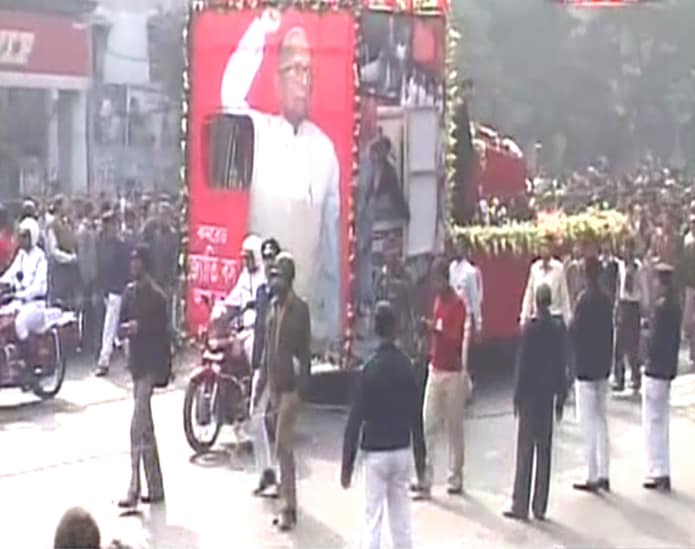 Basu's body was later taken to the Writers' Building - State Secretariat, in a hearse decorated in red with a large portrait of the veteran communist leader forming the backdrop, escorted by police motorcycles and jeeps.