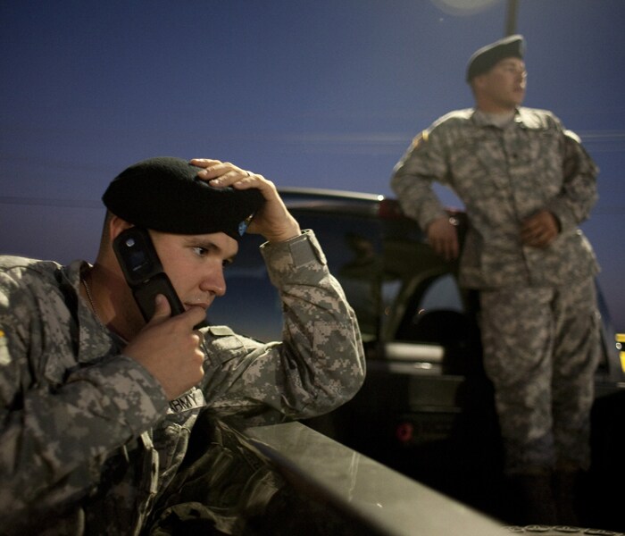 Officers wait to enter Fort Hood near the main entrance to the base where the incident took place.(AFP Photo)