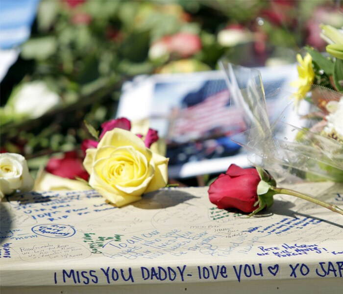 Family members of September 11 victims recited loved ones' names through tears on the ninth anniversary of the attacks on Saturday.<br><br>Gathering at observances in New York and Pennsylvania, the family members brought flowers, pictures of loved ones and American flags. (AFP)