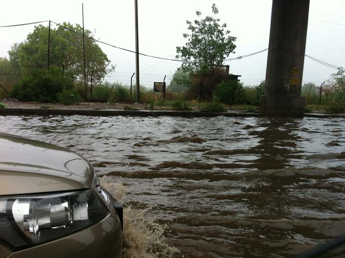 Yogesh shared this image showing a car navigate through deep waters on a Delhi road.