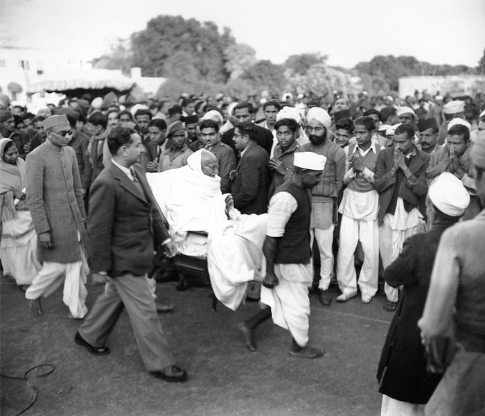 Mahatma Gandhi, is carried from his main house to the Garden area after breaking a five-day fast in New Delhi, India on January 21, 1948.<br><br>(Photo: AP)